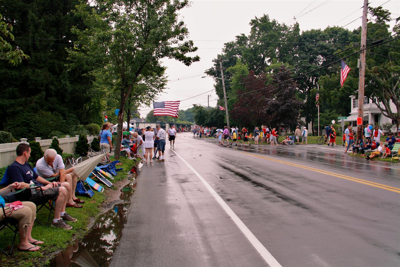 A large flag flies high above Hingham Center